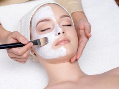 12084638 - beautiful young woman having a facial cosmetic mask at spa salon