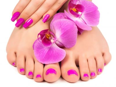 18875326 - pink manicure and pedicure with a orchid flower